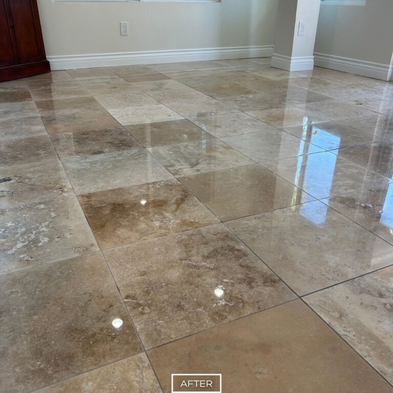 Finished travertine floor restoration in Dana Point with even color and polish