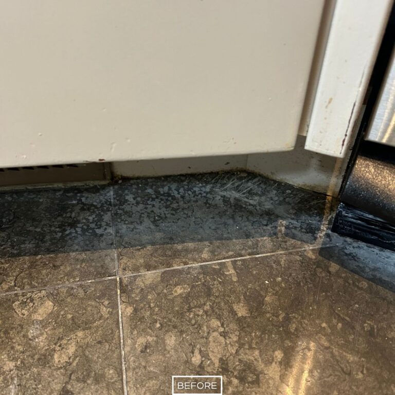 Close up of an etched and dull limestone floor in a Newport Beach kitchen