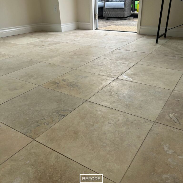 Before travertine floor restoration in Dana Point showing dull surface and stains